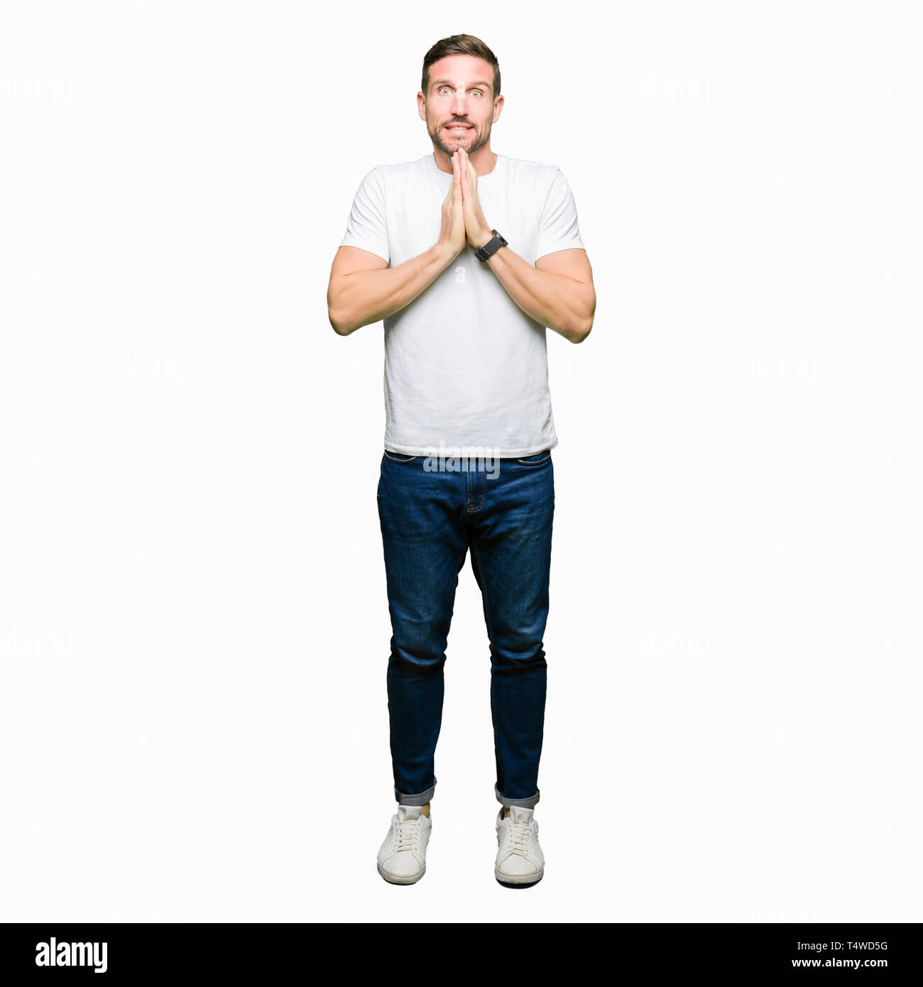 Handsome Man Wearing Casual White T Shirt Praying With Hands Together 9091