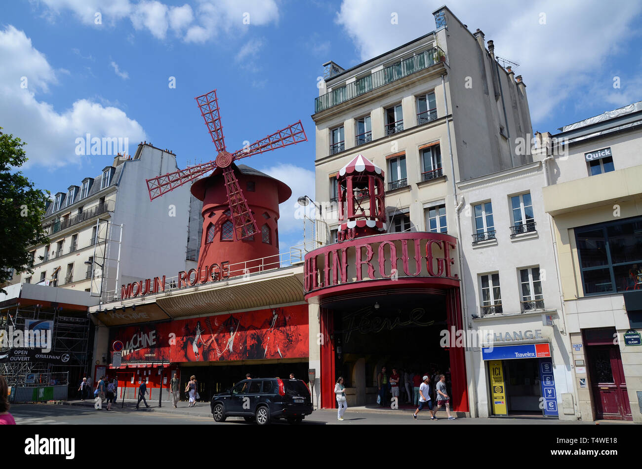Moulin Rouge cabaret theatre in Paris, France, Europe. Red Mill, or red windmill, on top, in Boulevard de Clichy, Paris Stock Photo