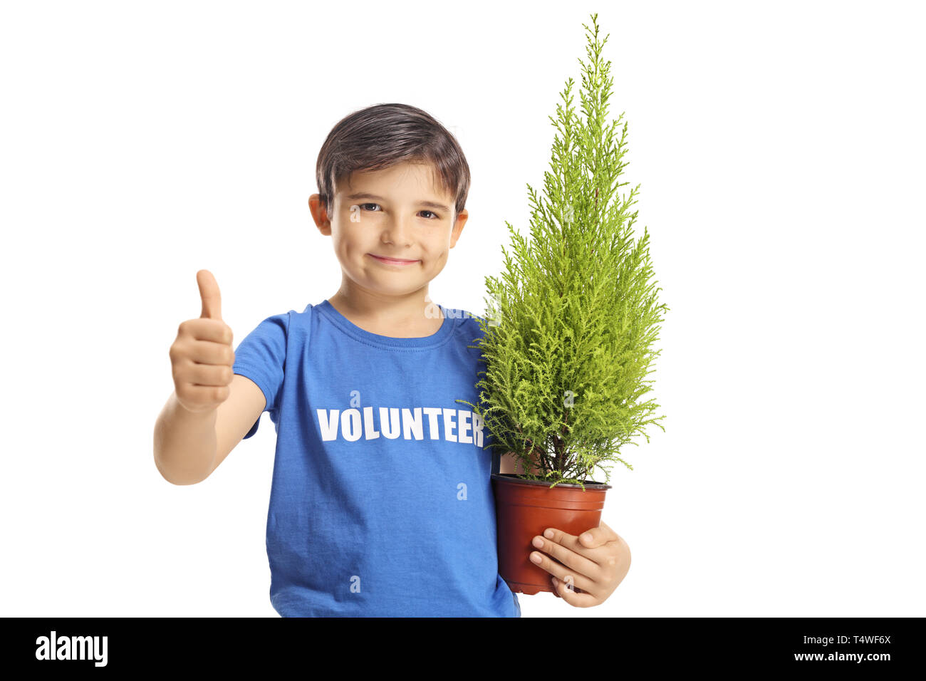 Young boy volunteer with a plant making thumbs up isolated on white background Stock Photo