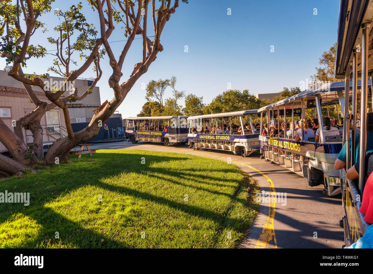 Studio Tour Tram with tourists driving through Universal Studios Hollywood Stock Photo