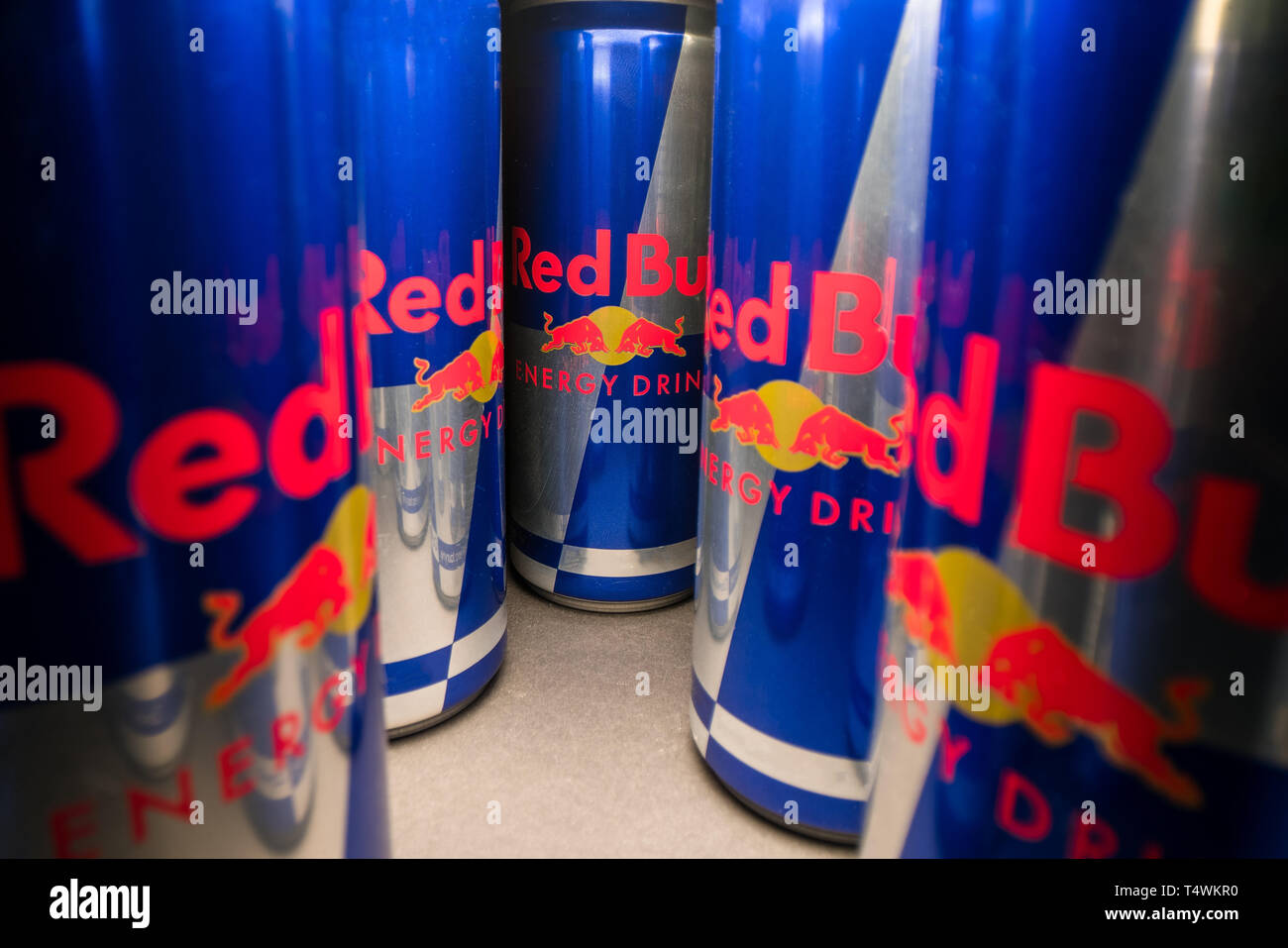 PRAGUE, CZECH REPUBLIC - April 16th, 2019: wide angle view of aluminum Red Bull energy drink can on dark background. Redbull drink is popular in youth Stock Photo