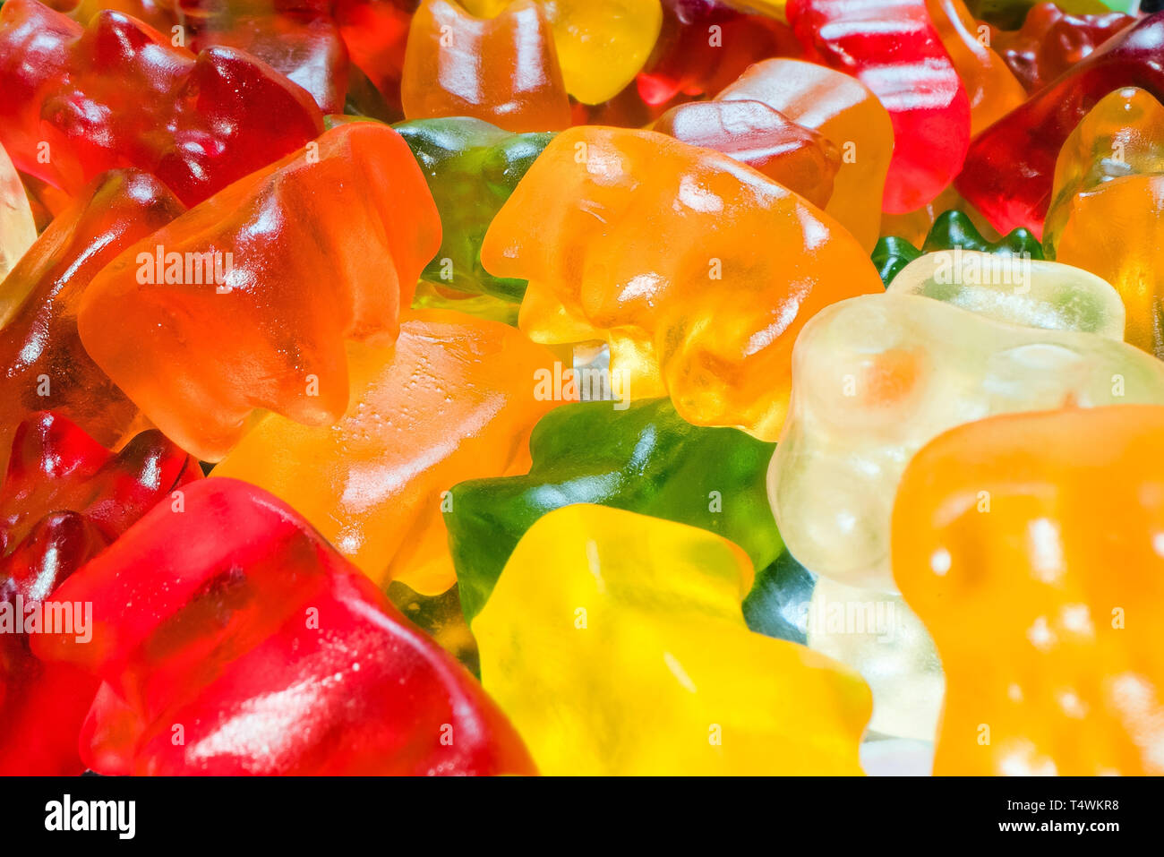 Pile of delicious, colourful Gummy Bears candy. Marco shot of gummy bear jelly sweets Stock Photo