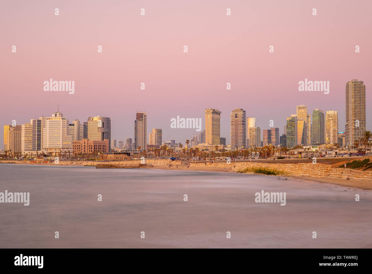 skyline of Tel Aviv, Israel by the beach at dusk Stock Photo
