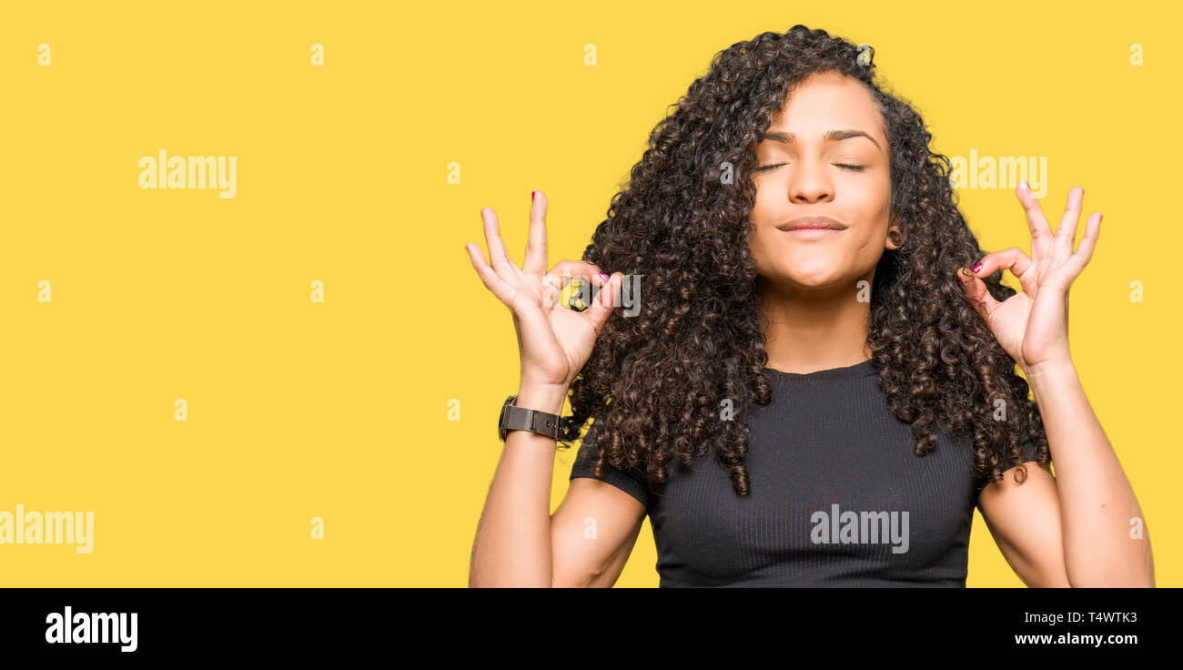 Young Beautiful Woman With Curly Hair Relax And Smiling With Eyes