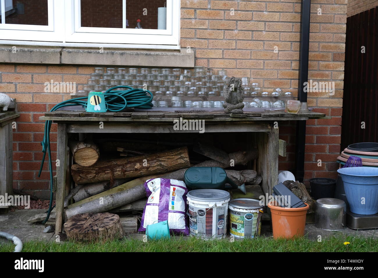 Garden bench in back garden in Glasgow Stock Photo