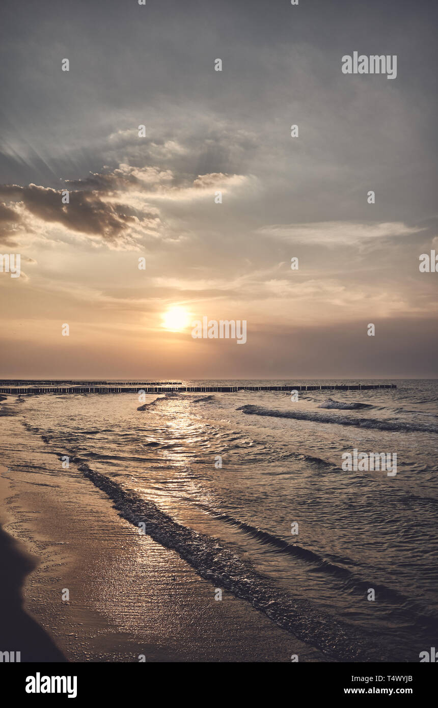 Scenic sunset over the sea, color toning applied. Stock Photo