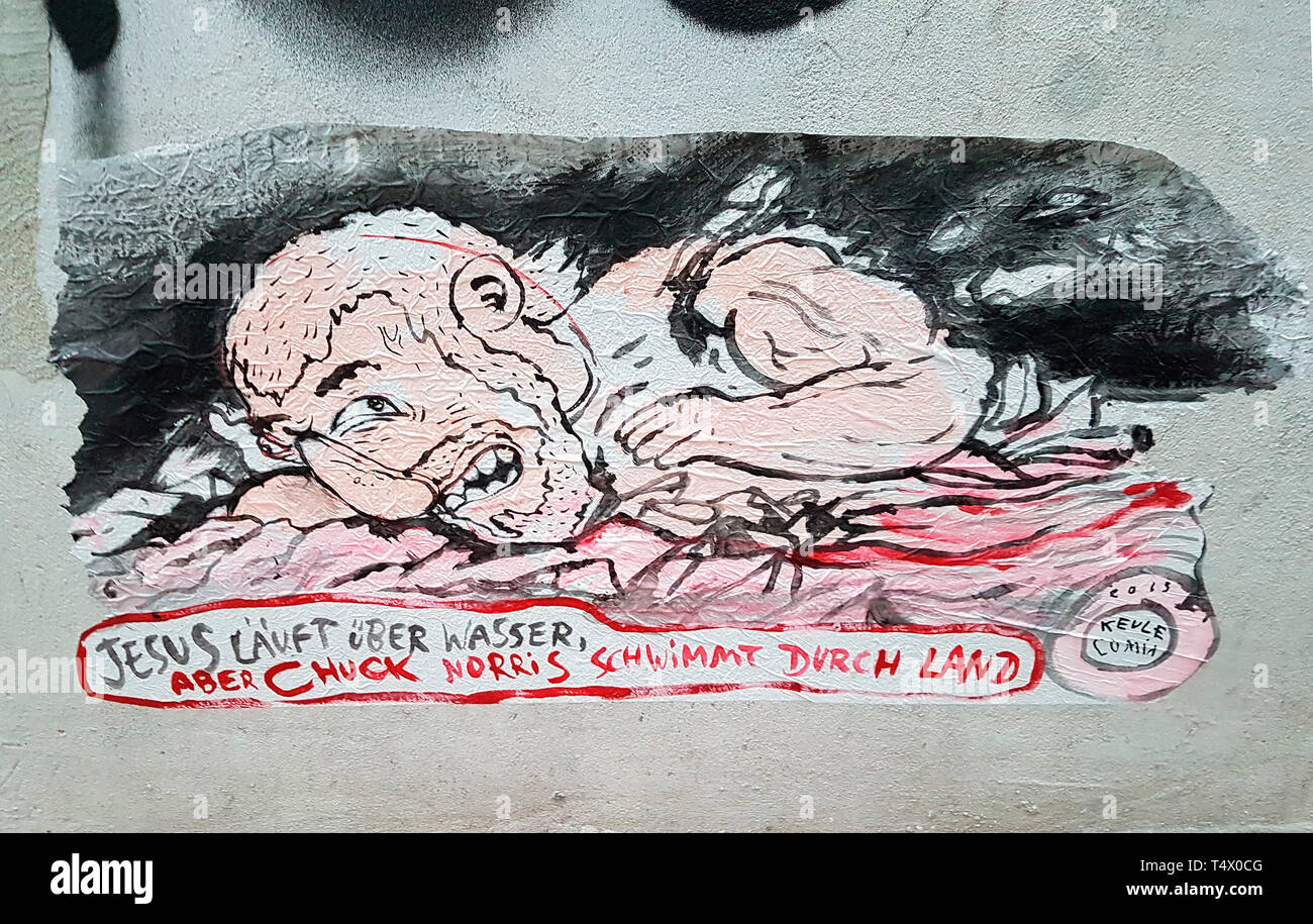 Graffity: 'Jesus laeuft uebers Wasser, aber Chuck Norris schwimmt durch Land' , Berlin. Stock Photo
