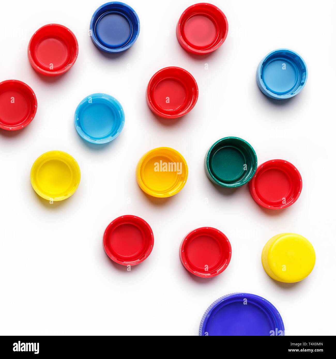 Colored plastic bottle's covers on white Stock Photo Alamy