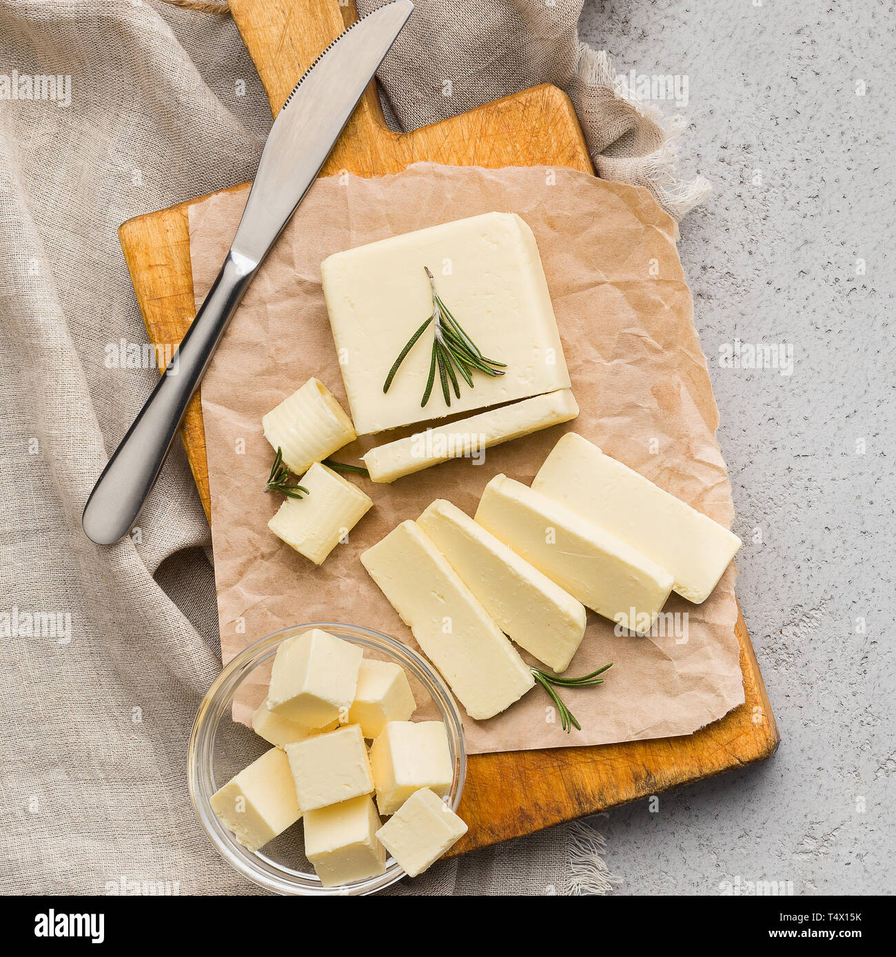 Block of butter on board Stock Photo