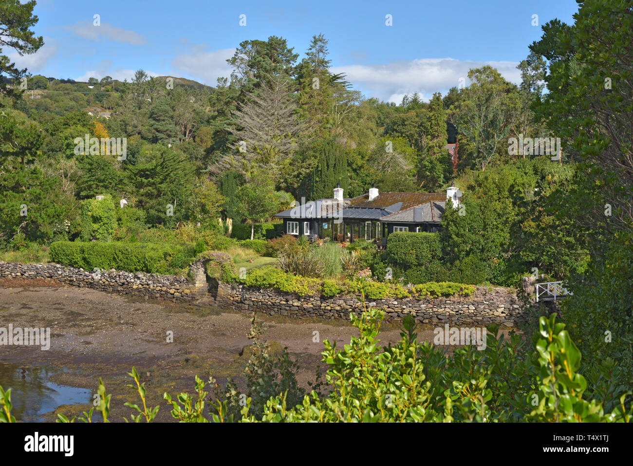 Bungalow on Shore by Bamboo Park Glengarriff Harbour Stock Photo