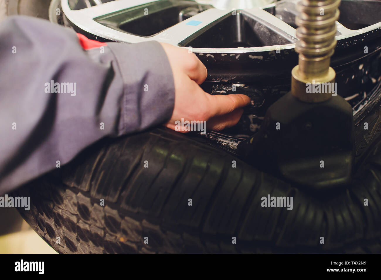 tire pressure sensor installation, car, test procedure in a carcare center Stock Photo Alamy