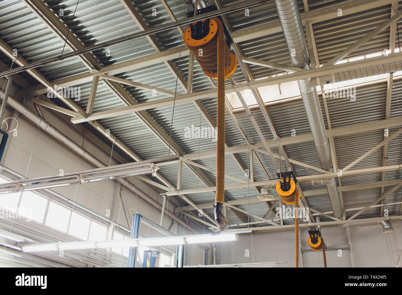 The device for removing exhaust gases in the car repair shop. Car