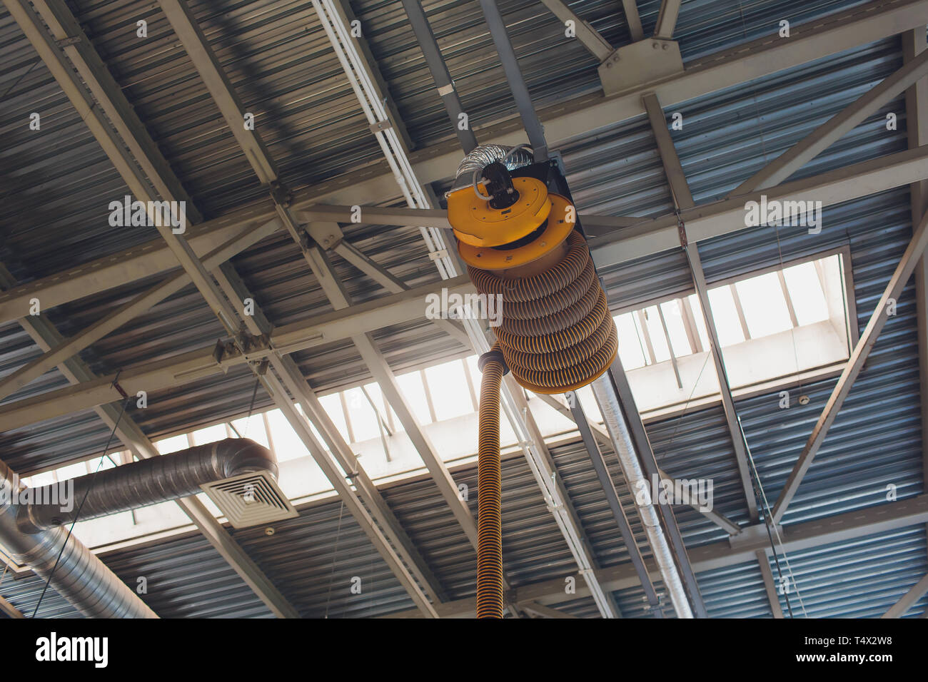 The device for removing exhaust gases in the car repair shop. Car