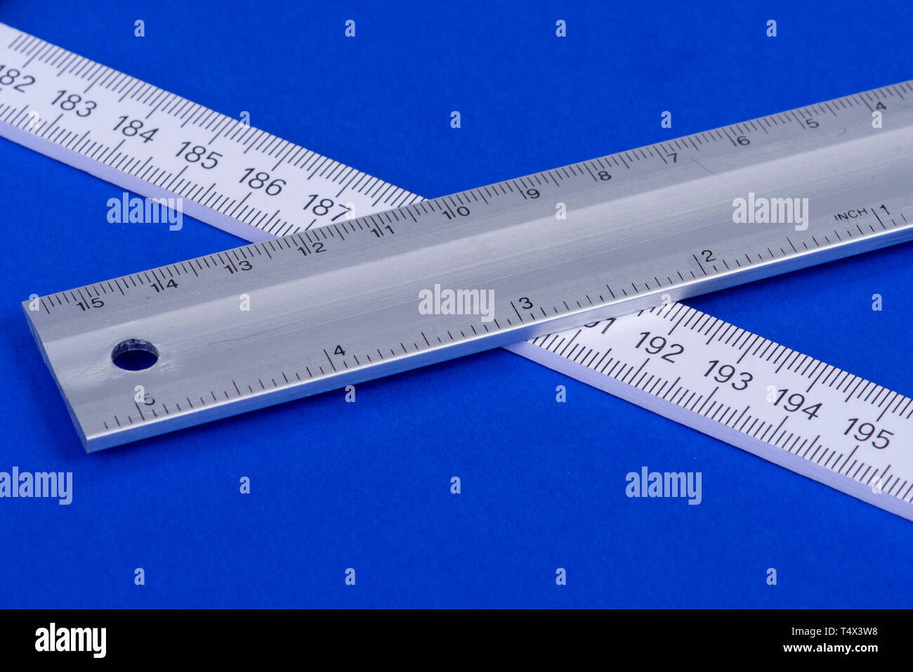 Ruler and angle on blue background Stock Photo - Alamy