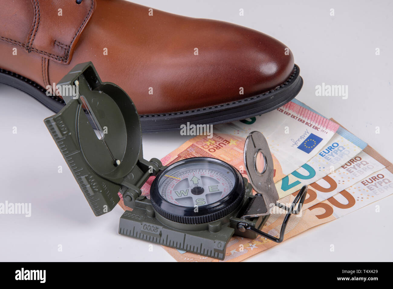business shoe with compass and euro notes Stock Photo Alamy