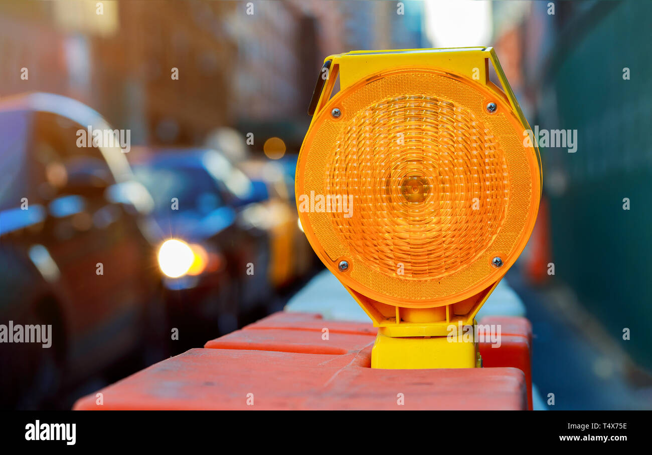 Orange traffic barrier barrels to detour traffic around construction