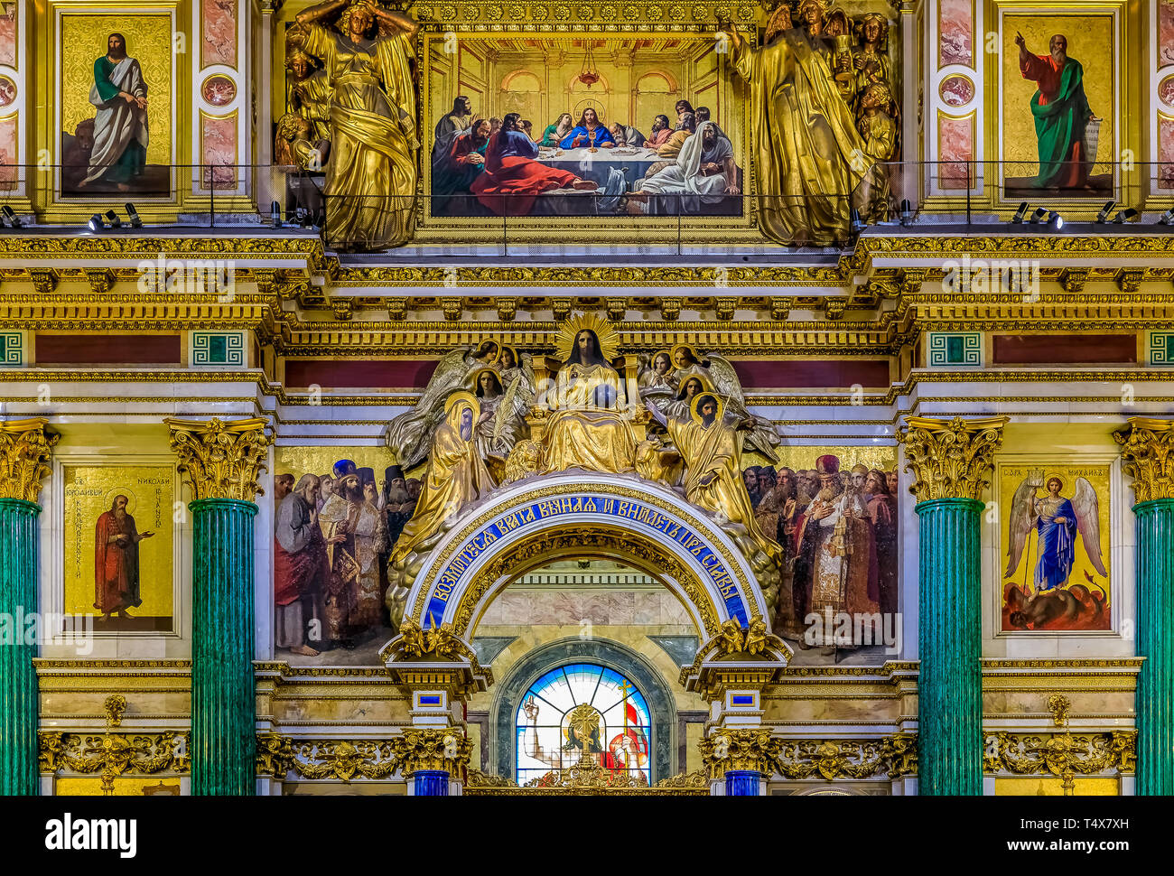 Saint Petersburg, Russia - September 10, 2017: Ornate interior, malachite columns, golden relief and colorful icons depicting Jesus Christ and saints  Stock Photo