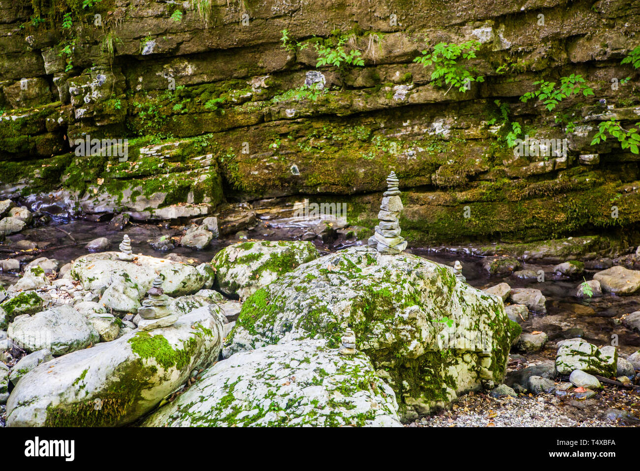 Piles of rocks called cairns on the bank of the stream Stock Photo Alamy