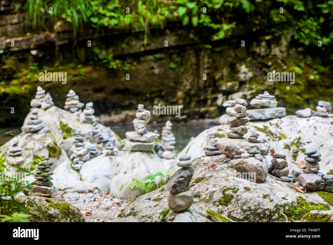 Piles of rocks called cairns on the bank of the stream Stock Photo Alamy