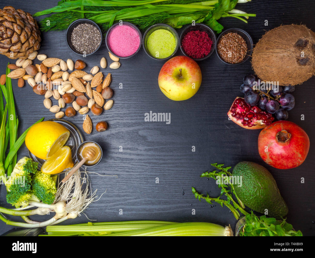 Various colorful superfoods as acai powder, matcha powder, spirulina, seeds,  blueberry, dried goji berries, honey, giner, citrus, coconut, avocado, po  Stock Photo - Alamy