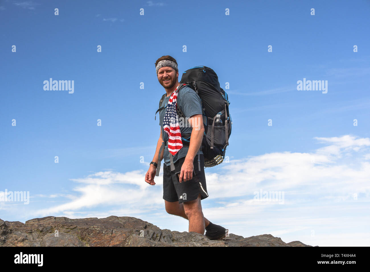 Rugged male backpacker hiking on Appalachian Trail, with pack, in the Great Smoky Mountains National Park in autumn, outside Gatlinburg, TN, USA Stock Photo