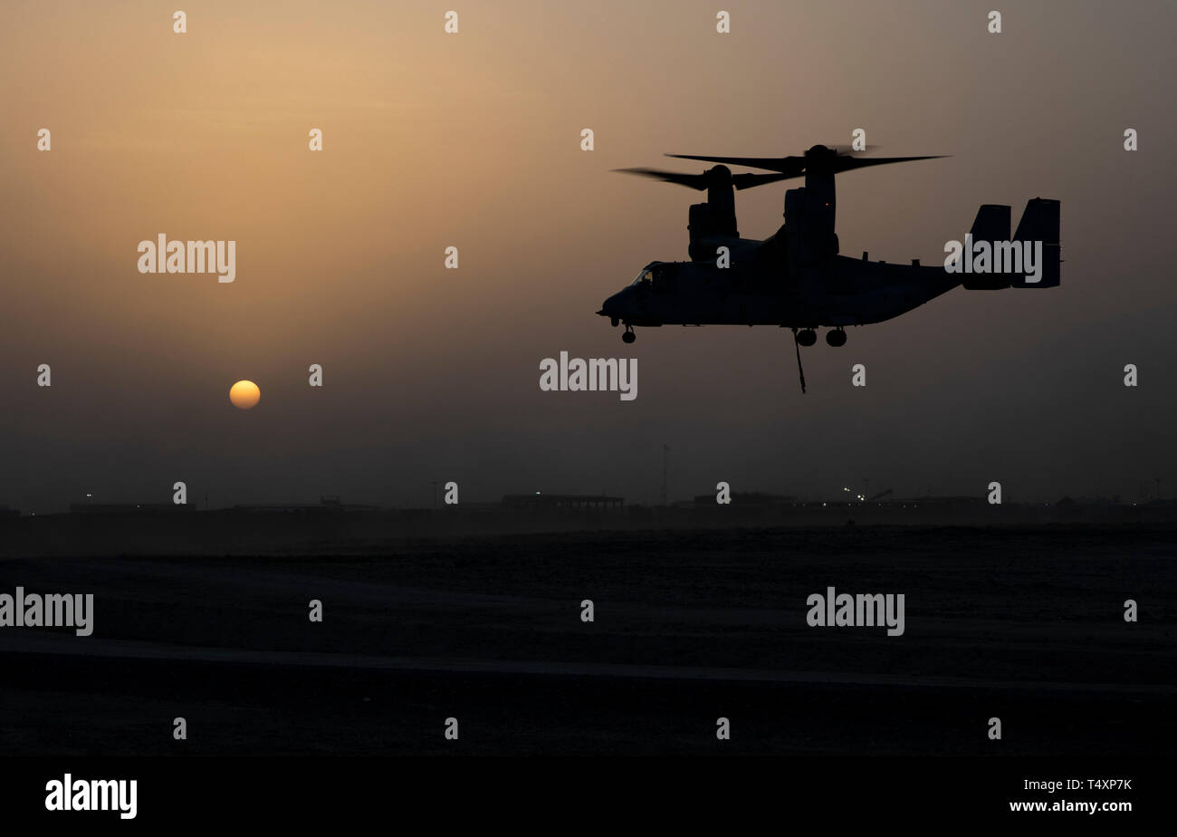 CAMP BEUHRING, Kuwait (April 11, 2019) A U.S. Marine MV-22 Osprey with the 22nd Marine Expeditionary Unit prepares to land after finishing helicopter support team training during Marine Expeditionary Unit Exercise. The Marines, with Marine Medium Tiltrotor Squadron 264 (Reinforced) and Combat Logistics Battalion 22, participated the training to build and sharpen their skills in order to maintain combat readiness. Marines and Sailors with the 22nd MEU and Kearsarge Amphibious Ready Group are currently deployed to the U.S. 5th Fleet area of operations in support of naval operations to ensure mar Stock Photo