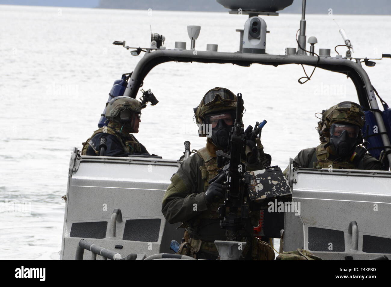 Maritime Security Response Team West members are ready to respond in a full-scale exercise, called Operation Pelagic Strike, to train in a multiagency simulated terrorist situation aboard a ferry in Cordova, Alaska, April 10, 2019.  MSRT West personnel trained with Alaska FBI’s Joint Terrorism Task Force to ensure that if a threat were encountered in Alaska that the systems were in place to keep the public safe.  U.S. Coast Guard photo by Chief Petty Officer Matthew Schofield. Stock Photo