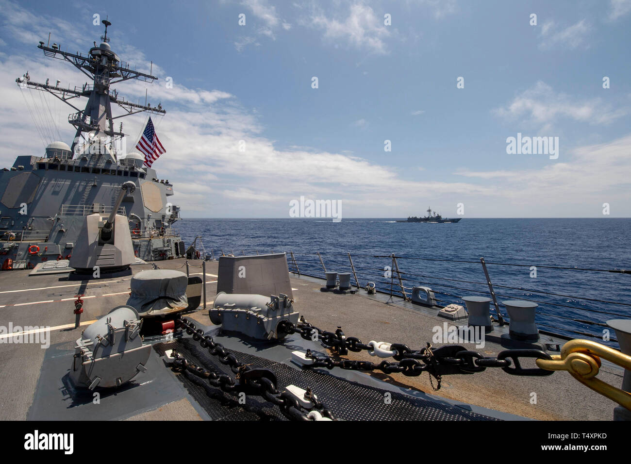 190418-N-UI104-0237     PHILIPPINE SEA (April 18, 2019) The Arleigh Burke-class guided-missile destroyer USS Preble (DDG 88) and the Royal Australian Navy Adelaide-class guided-missile frigate HMAS Melbourne (FFG 05) transit in formation during a cooperative deployment. Preble and Melbourne are participating in a cooperative deployment in order to improve on maritime capabilities between partners.  Preble is deployed to the U.S 7th Fleet area of operations in support of security and stability in the Indo-Pacific region. (U.S. Navy photo by Mass Communication Specialist 1st Class Bryan Niegel/R Stock Photo