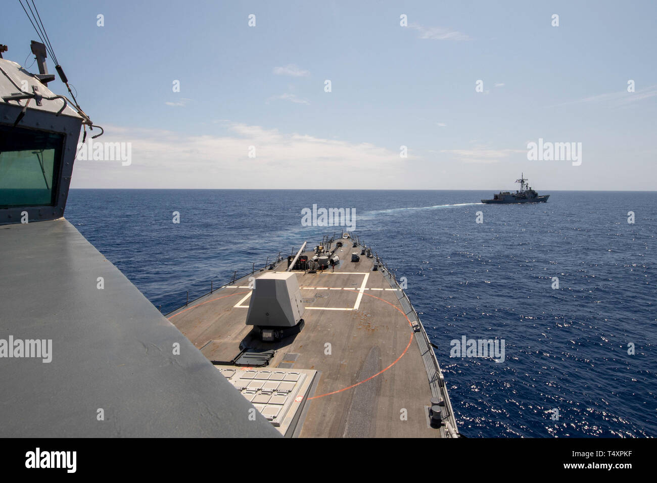 190418-N-UI104-0307     PHILIPPINE SEA (April 18, 2019) The Arleigh Burke-class guided-missile destroyer USS Preble (DDG 88) and the Royal Australian Navy Adelaide-class guided-missile frigate HMAS Melbourne (FFG 05) transit in formation during a cooperative deployment. Preble and Melbourne are participating in a cooperative deployment in order to improve on maritime capabilities between partners.  Preble is deployed to the U.S 7th Fleet area of operations in support of security and stability in the Indo-Pacific region. (U.S. Navy photo by Mass Communication Specialist 1st Class Bryan Niegel/R Stock Photo