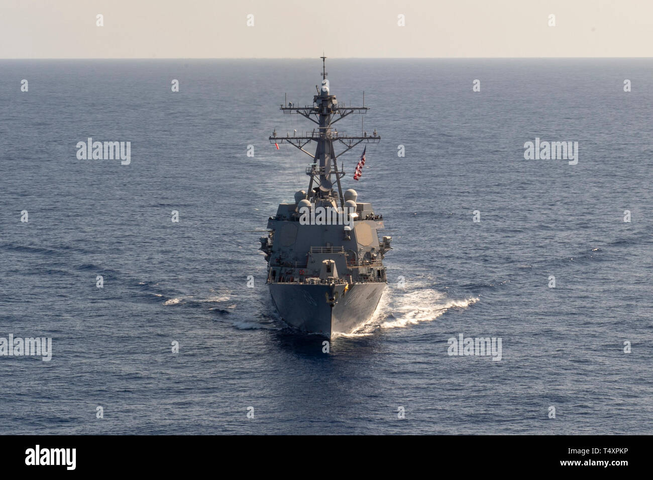 190418-N-UI104-0391     PHILIPPINE SEA (April 18, 2019) The Arleigh Burke-class guided-missile destroyer USS Preble (DDG 88) steams through the water during a cooperative deployment. Preble is participating with the Royal Australian Navy Adelaide-class guided-missile frigate HMAS Melbourne (FFG 05) in a cooperative deployment in order to improve on maritime capabilities between partners.  Preble is deployed to the U.S 7th Fleet area of operations in support of security and stability in the Indo-Pacific region. (U.S. Navy photo by Mass Communication Specialist 1st Class Bryan Niegel/Released) Stock Photo