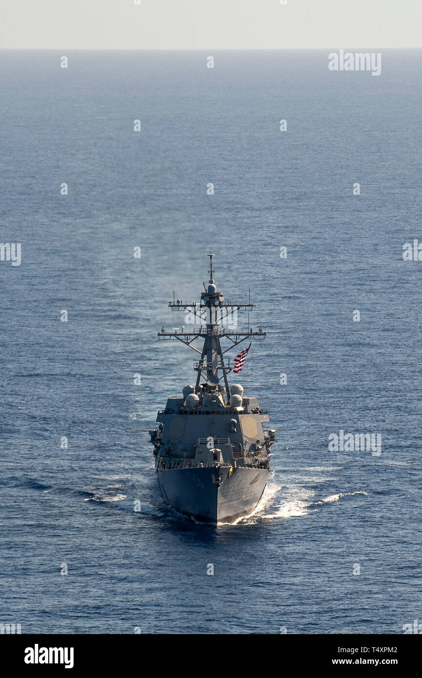190418-N-UI104-0606     PHILIPPINE SEA (April 18, 2019) The Arleigh Burke-class guided-missile destroyer USS Preble (DDG 88) steams through the water during a cooperative deployment. Preble is participating with the Royal Australian Navy Adelaide-class guided-missile frigate HMAS Melbourne (FFG 05) in a cooperative deployment in order to improve on maritime capabilities between partners.  Preble is deployed to the U.S 7th Fleet area of operations in support of security and stability in the Indo-Pacific region. (U.S. Navy photo by Mass Communication Specialist 1st Class Bryan Niegel/Released) Stock Photo