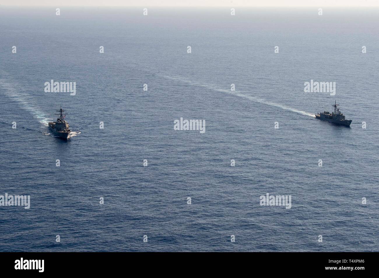 190418-N-UI104-0633    PHILIPPINE SEA (April 18, 2019) The Arleigh Burke-class guided-missile destroyer USS Preble (DDG 88) and the Royal Australian Navy Adelaide-class guided-missile frigate HMAS Melbourne (FFG 05) transit in formation during a cooperative deployment. Preble and Melbourne are participating in a cooperative deployment in order to improve on maritime capabilities between partners.  Preble is deployed to the U.S 7th Fleet area of operations in support of security and stability in the Indo-Pacific region. (U.S. Navy photo by Mass Communication Specialist 1st Class Bryan Niegel/Re Stock Photo