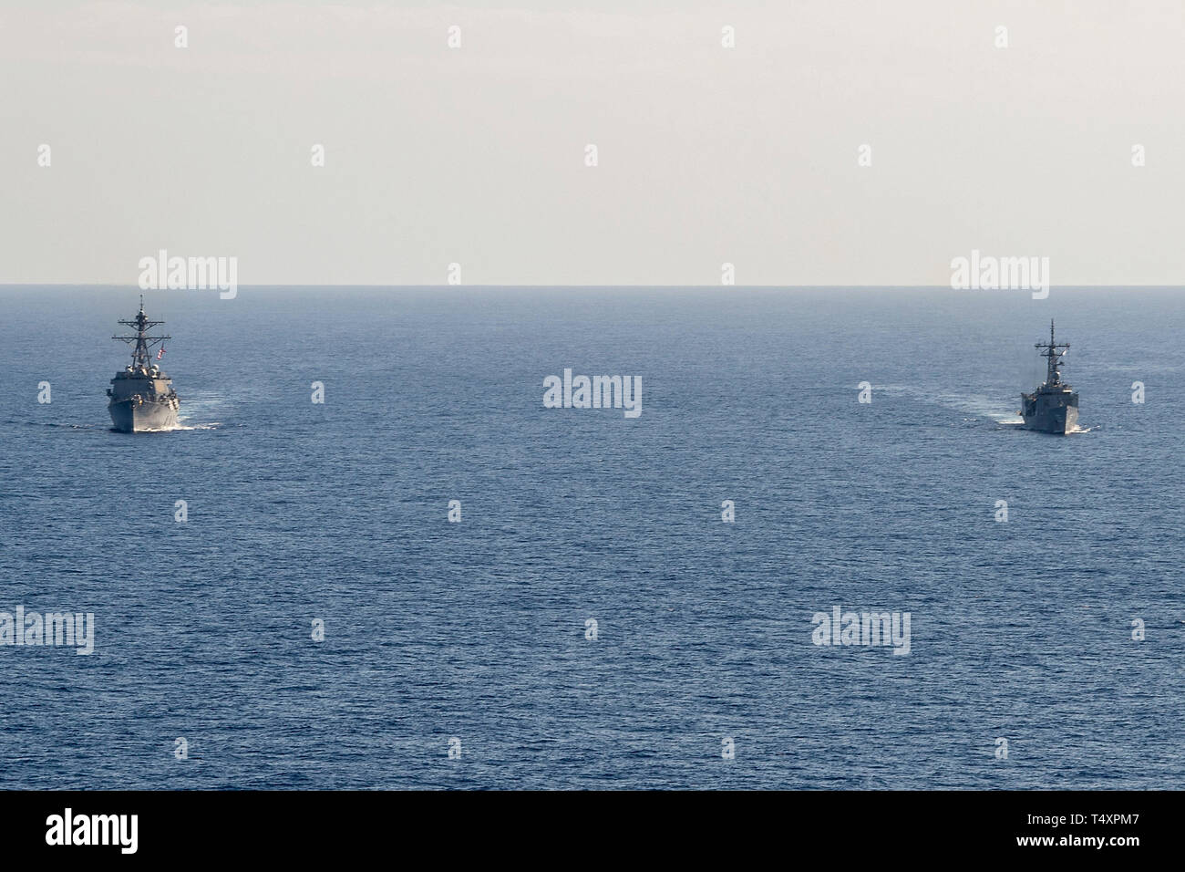 190418-N-UI104-0667    PHILIPPINE SEA (April 18, 2019) The Arleigh Burke-class guided-missile destroyer USS Preble (DDG 88) and the Royal Australian Navy Adelaide-class guided-missile frigate HMAS Melbourne (FFG 05) transit in formation during a cooperative deployment. Preble and Melbourne are participating in a cooperative deployment in order to improve on maritime capabilities between partners.  Preble is deployed to the U.S 7th Fleet area of operations in support of security and stability in the Indo-Pacific region. (U.S. Navy photo by Mass Communication Specialist 1st Class Bryan Niegel/Re Stock Photo