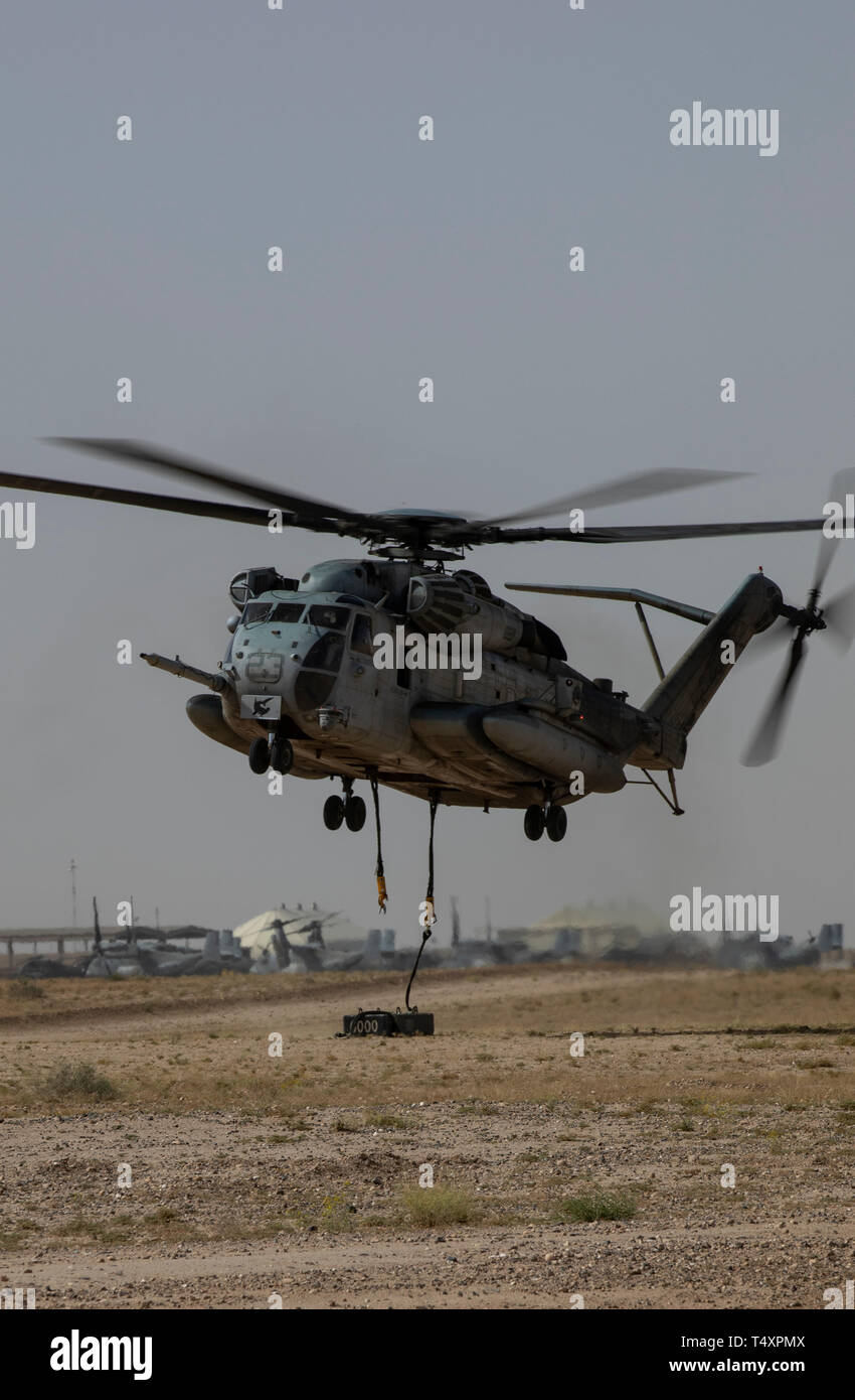 CAMP BEUHRING, Kuwait (April 11, 2019) A U.S. Marine CH-53E Super Stallion with the 22nd Marine Expeditionary Unit detaches a 6,000 pound beam as part of helicopter support team training during Marine Expeditionary Unit Exercise. The Marines, with Marine Medium Tiltrotor Squadron 264 (Reinforced) and Combat Logistics Battalion 22, participated the training to build and sharpen their skills in order to maintain combat readiness. Marines and Sailors with the 22nd MEU and Kearsarge Amphibious Ready Group are currently deployed to the U.S. 5th Fleet area of operations in support of naval operation Stock Photo