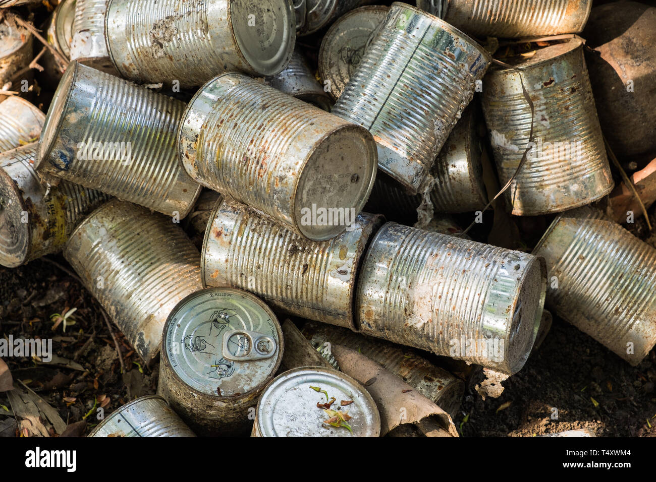 canned package old cluster pile midden Stock Photo