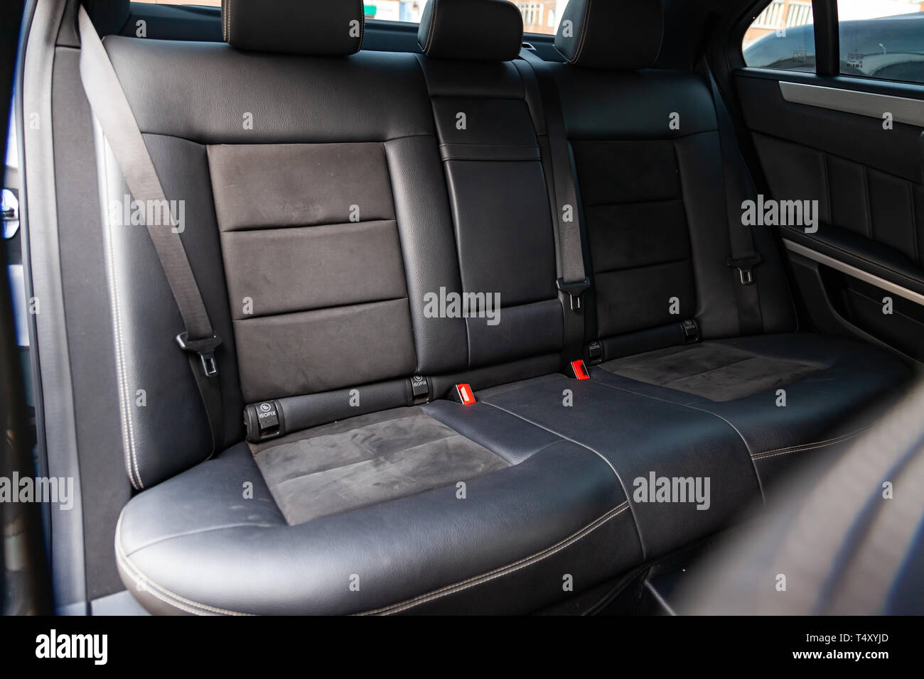 Novosibirsk, Russia - 04.12.2019: The interior of the car Mercedes Benz E-class E250 with a view of the rear seats with light gray trim Stock Photo