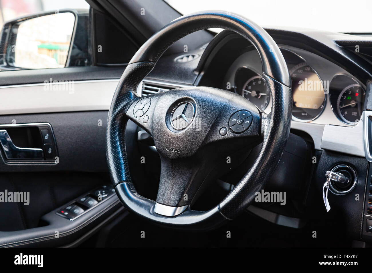 Novosibirsk, Russia - 04.12.2019: The interior of the car Mercedes Benz E-class E250 with a view of the steering wheel, dashboard, seats and multimedi Stock Photo