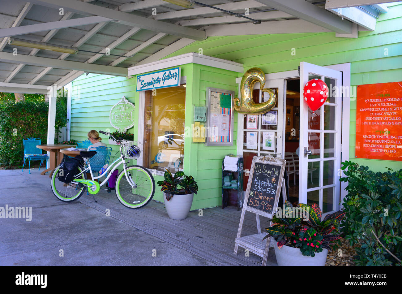 A welcoming entrance to PJs Seagrille and the Serendipity Gallery with patio cafe and colorful vibe in Boca Grande, FL on Gasparilla Island Stock Photo