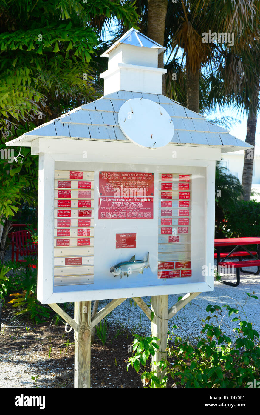 The Boca Grande, FL, fishing guide association's sign listing local guides' contact info and more about their organization on the beach on Gasparilla Stock Photo