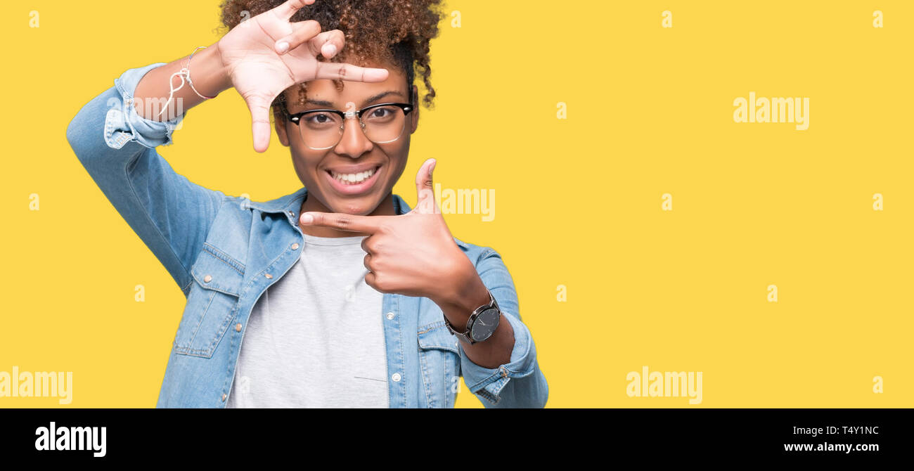 Beautiful young african american woman wearing glasses over isolated ...