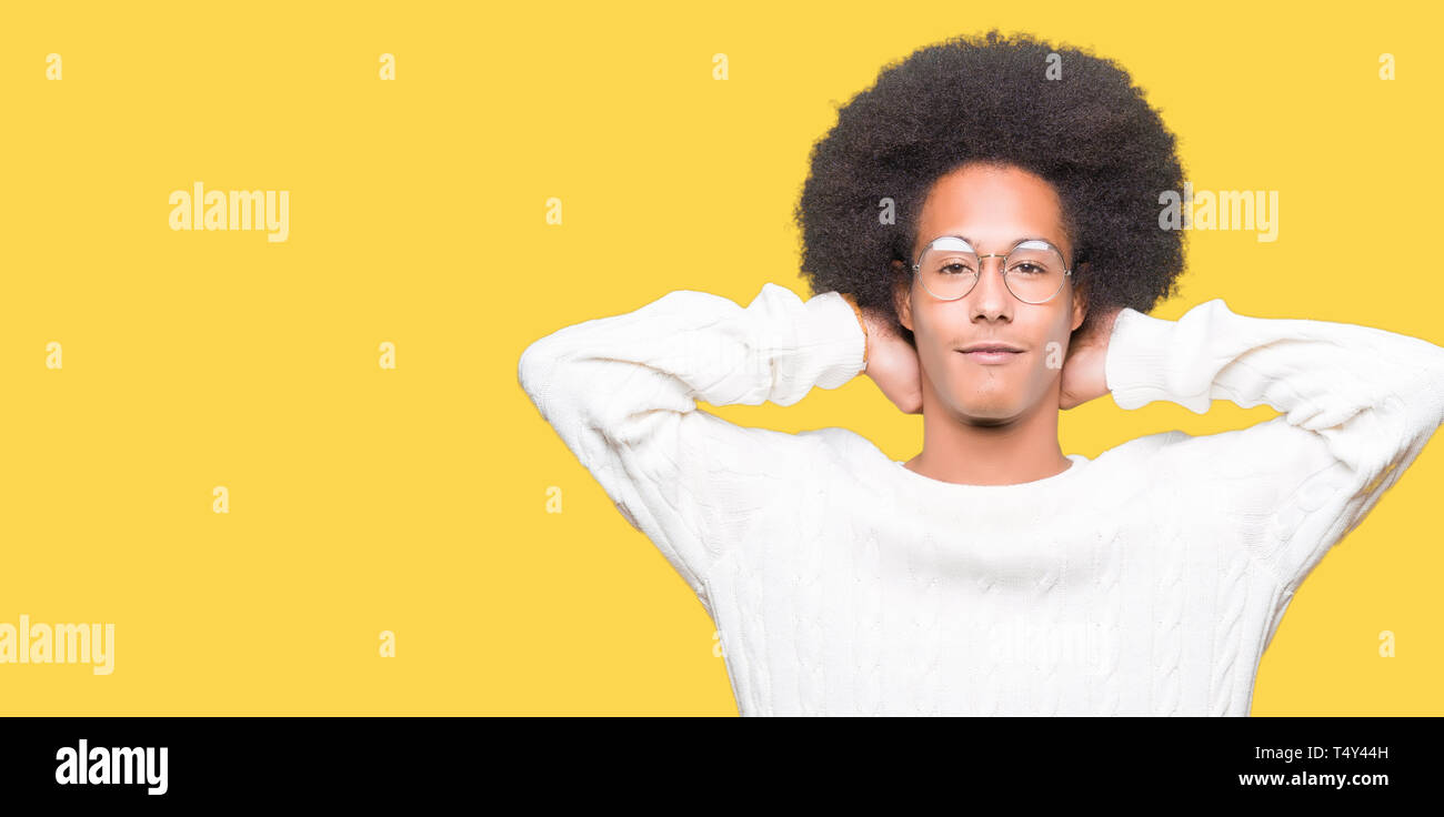 Young African American Man With Afro Hair Wearing Glasses Relaxing
