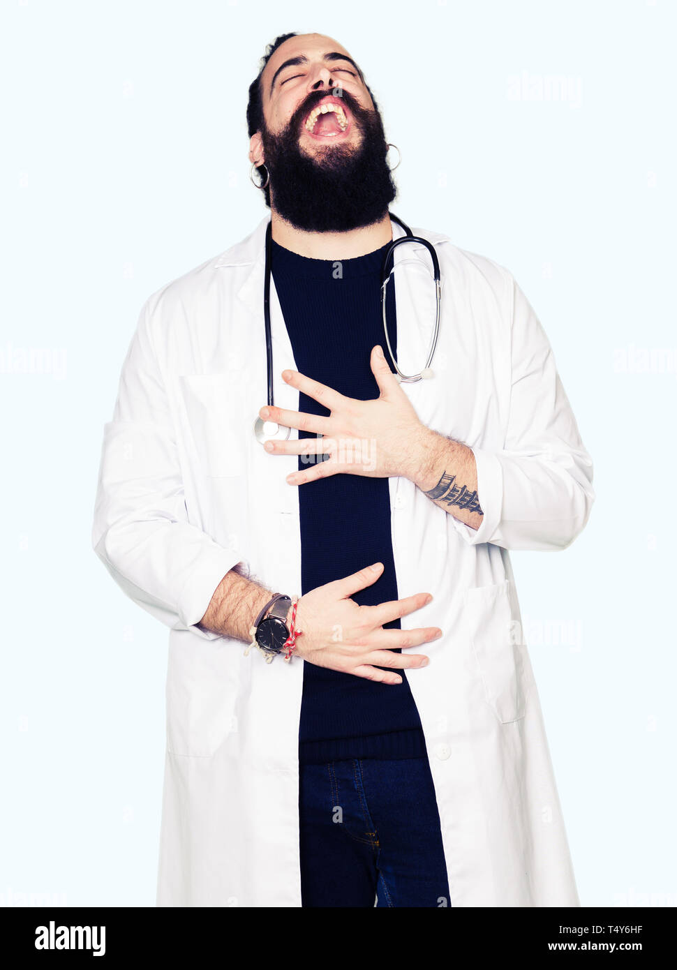 Doctor with long hair wearing medical coat and stethoscope Smiling and