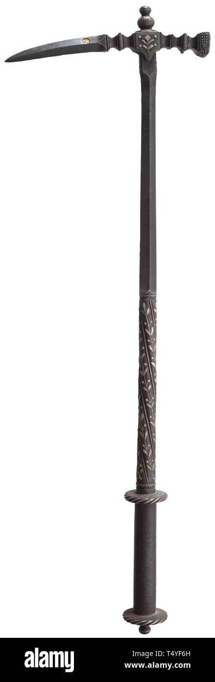 A silver-inlaid war hammer historicism, in the style of circa 1600. Elaborately chiselled head with rich silver inlays. One side of the slender beak-shaped fluke of quadrangular section struck with a smith´s mark (horseman) against a gold background. The two-stage shaft first of diamond, then of circular section. Rich silver-inlaid foliage decoration, the handle with two silver-inlaid guard disks. Length 73 cm. Extremely elaborate, excellently crafted work of early Historicism. historic, historical, tool, tools, military, militaria, fighting devi, Additional-Rights-Clearance-Info-Not-Available Stock Photo