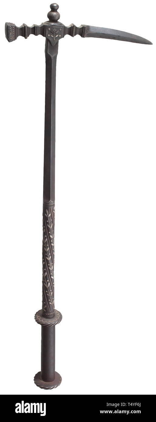 A silver-inlaid war hammer historicism, in the style of circa 1600. Elaborately chiselled head with rich silver inlays. One side of the slender beak-shaped fluke of quadrangular section struck with a smith´s mark (horseman) against a gold background. The two-stage shaft first of diamond, then of circular section. Rich silver-inlaid foliage decoration, the handle with two silver-inlaid guard disks. Length 73 cm. Extremely elaborate, excellently crafted work of early Historicism. historic, historical, tool, tools, military, militaria, fighting devi, Additional-Rights-Clearance-Info-Not-Available Stock Photo