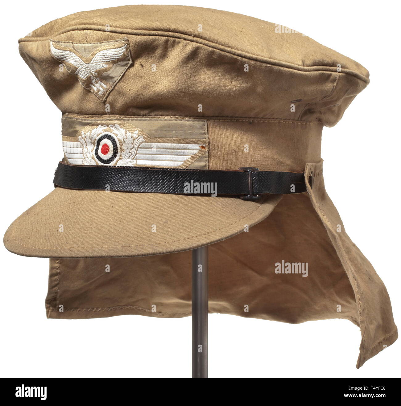 A tropical visor cap of the Afrika Korps. Sand-coloured cotton material  with a long visor, the BeVo weave insignia as originally sewn-in, leather  chin strap (damaged). The inner red liner is stamped "