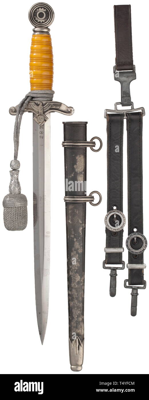 A dagger M 38 for leaders, complete with service hanger and sword knot. The blade (minimally stained) with reverse Eickhorn logo and TeNo acceptance, obverse arms number '2879'. Silvered quillons and pommel with areas of patina, orange-coloured plastic grip. The scabbard (small dent) with mostly intact black toning, the locket with matching number '2879'. Length 41 cm. Complete with service hanger and belt loop of dark blue leather. historic, historical, technical, technic, emergency aid, object, objects, stills, clipping, clippings, cut out, cut-out, cut-outs, utensil, pie, Editorial-Use-Only Stock Photo