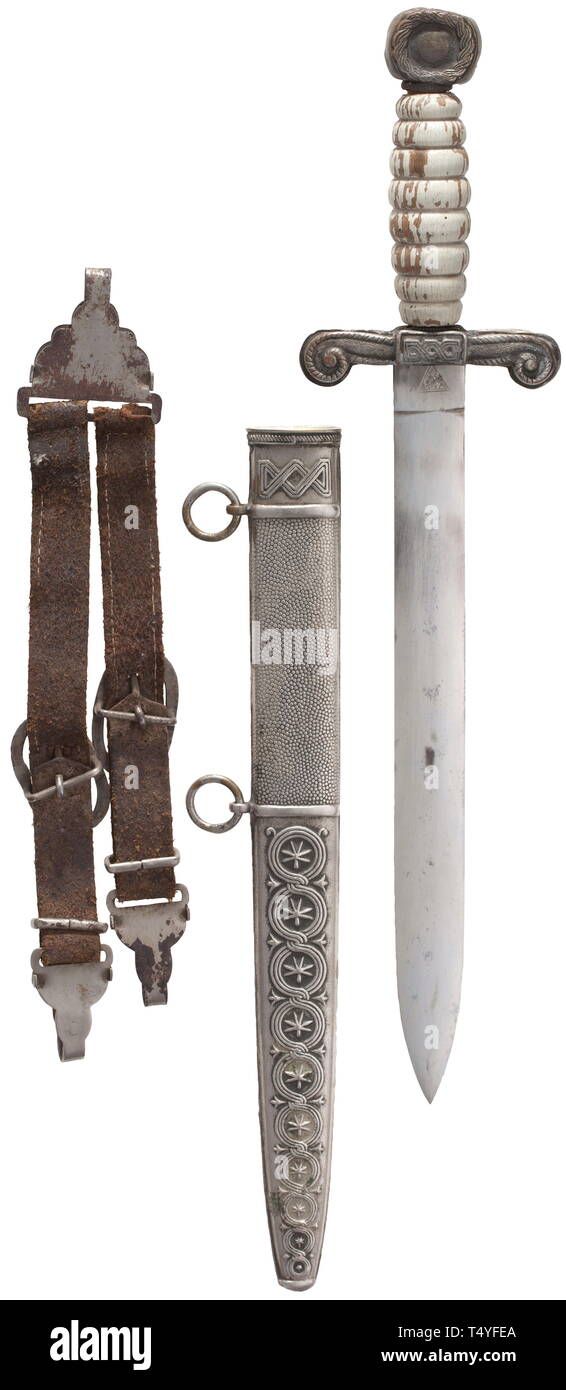 A Ustasha dagger with hanger. Symmetrical blade of lenticular cross section (lightly stained), reverse maker's mark 'Josip Bobek Zagreb'. The hilt of silvered non-ferrous metal, white painted wood grip, the pommel with initials 'NHD' (Nezavisna Drzava Hrvatska - the Autonomous State of Croatia). Scabbard of brass, the locket marked 'Braca Knaus Zagreb'. Including the leather hanger with applied laces on the front side. Signs of usage and age. Length ca. 40 cm. Rare. 22151 historic, historical, 20th century, Additional-Rights-Clearance-Info-Not-Available Stock Photo