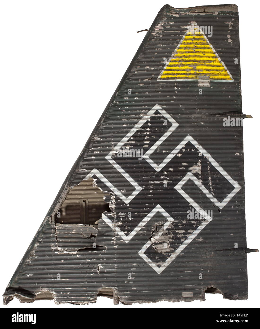 A Junkers JU-52 tail unit with tactical and national symbols. The tail unit of aluminium worked in multiple layers, multi-riveted, labelled and painted in typical Luftwaffe grey. A national emblem at the middle, above which is a tactical symbol for the third aircraft of the squadron. Riveted-on type plate with designation '010 - 1508 - mdq'. Marks of age and damage. Dimensions ca. 180 x 210 x 35 cm, weight ca. 20 kg. In 1944, this aircraft was forced to make an emergency landing in the vicinity of Salzburg, and its components were used by the civilian population after the d, Editorial-Use-Only Stock Photo