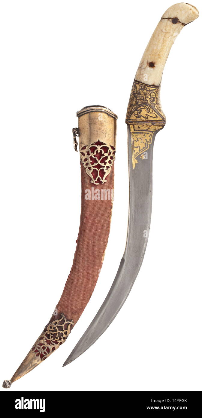 An Indian gold-inlaid pesh kabz, 19th century. Heavily curved single-edged blade of wootz Damascus with double-edged point. Both sides of the base, ferrule and grip frame with floral gold inlays. Riveted grip scales (both broken) of crystalline walrus ivory. Velvet-covered wood scabbard with openwork gilt silver fittings (two losses). Length 35.5 cm. historic, historical, 19th century, Additional-Rights-Clearance-Info-Not-Available Stock Photo
