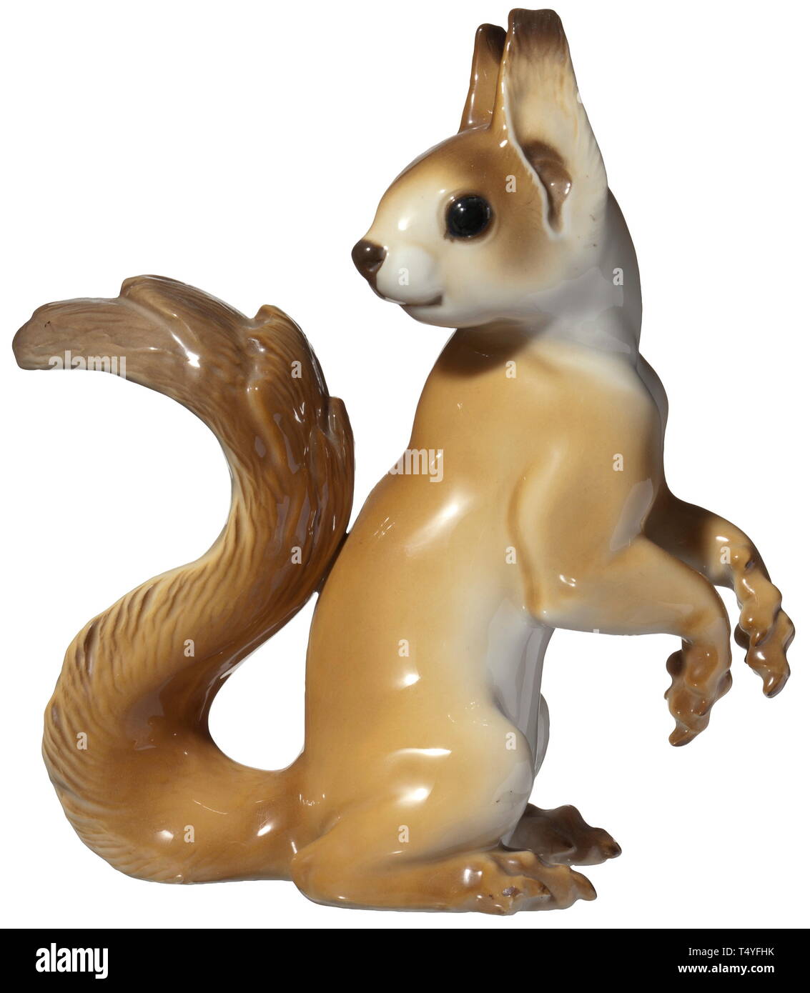 A squirrel. Coloured porcelain, in the bottom 'SS Allach' in green underglaze, impressed signature 'T. Kärner' and model number '68'. Height 15 cm. A rare figure in a completely, undamaged condition. historic, historical, porcelain, chinaware, 20th century, Editorial-Use-Only Stock Photo